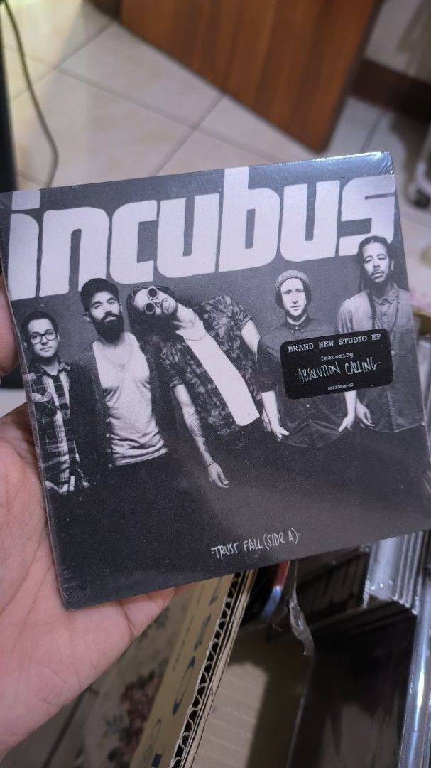 Incubus Trust Fall (Side A) cd sealed (Category: CDs & DVDs) located in Manila. Submitted by glanidajamil (Listing ID 1425350440, Image 1). Description: Incubus Trust Fall (Side A) vinyl record. Features the song "Absolution Calling". The record is still sealed in its original packaging. The album cover features a black and white photo of the band members. A sticker on the packaging indicates it is a "Brand New EP"..