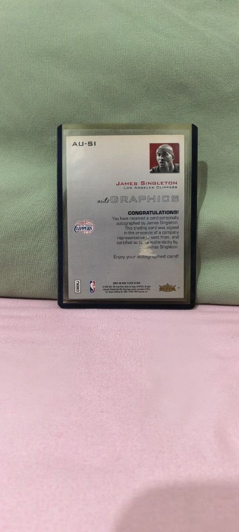 James Singleton Autograph Card (Category: Raw Singles) located in Las Pinas. Submitted by goldchrome25 (Listing ID 1425405489, Image 2). Description: Quentin Richardson autograph trading card, specifically from the 2003-04 Fleer Ultra Autographics set. Pre-Owned..