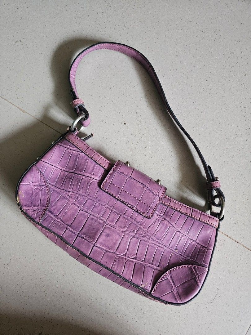 JLO by Jennifer Lopez Handbag (Category: Luxury Bags & Wallets) located in Cavite. Submitted by prelovedbysheimer (Listing ID 1425443905, Image 2). Description: Stylish handbag by JLO by Jennifer Lopez. Features a textured, purple exterior with silver-tone hardware. Includes a top handle and a secure clasp closure. The interior is lined with a matching purple fabric and includes a zippered pocket. The zipper pull has a decorative design. Perfect 
