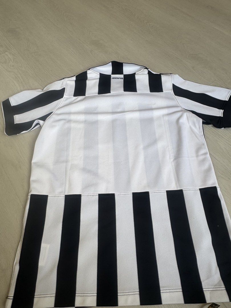 Juventus Jersey (Category: Other Sports Equipment and Supplies) located in Singapore. Submitted by acevin (Listing ID 1425319692, Image 3). Description: New unworn but washed. Have been kept in wardrobe for years. There's some yellowing on the shoulder area as in photo but this can be easily washed away, otherwise in great condition. Size: Boy XL equivalent to Adult size S. Dimension in photos. Smartpac delivery available at $4. .