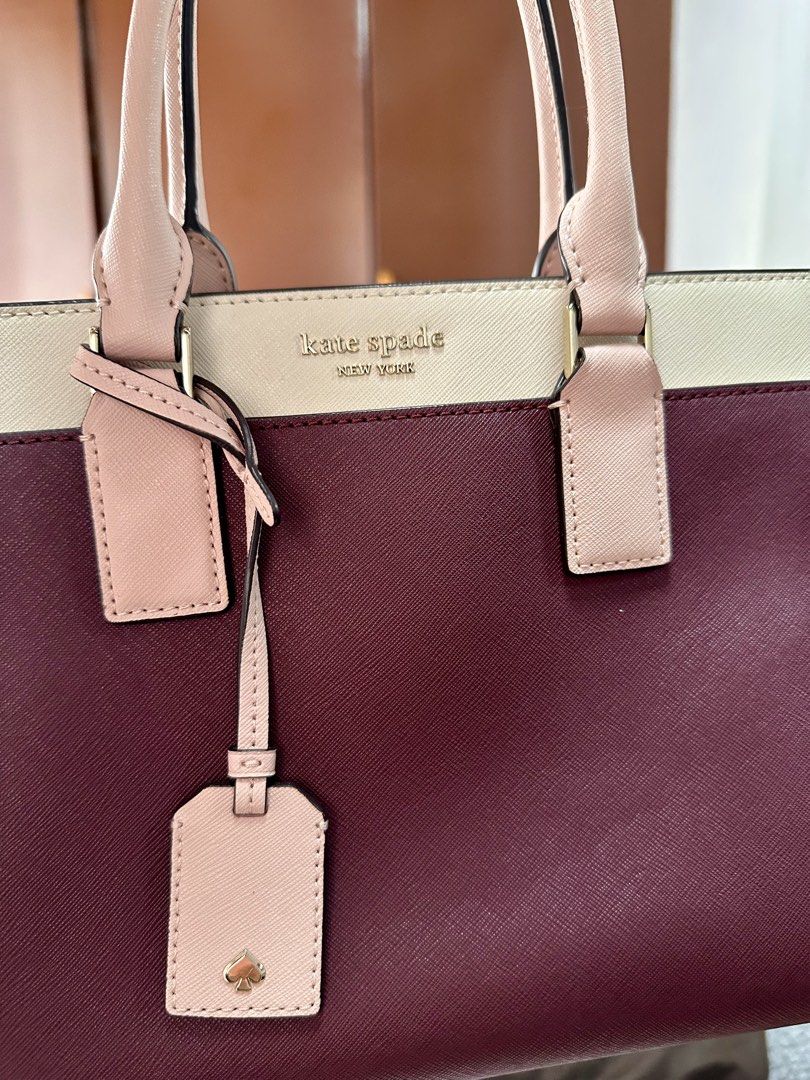 Kate Spade Cameron Medium Satchel (Category: Luxury Bags & Wallets) located in Malolos. Submitted by layntev (Listing ID 1425311245, Image 3). Description: Like new, only used twice Color is cherrywood. This color is sold out in Kate Spade websites. SIZE 8.5”h x 10.6”w x 4.7”d MATERIAL soft saffiano two way spade jacqard lining satchel with zip closure interior zip and slide pockets removable and adjustable strap drop length: 22” floating kate sp