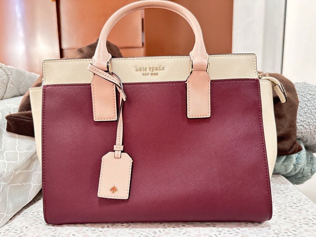 Kate Spade Cameron Medium Satchel (Category: Luxury Bags & Wallets) located in Malolos. Submitted by layntev (Listing ID 1425311245, Image 2). Description: Like new, only used twice Color is cherrywood. This color is sold out in Kate Spade websites. SIZE 8.5”h x 10.6”w x 4.7”d MATERIAL soft saffiano two way spade jacqard lining satchel with zip closure interior zip and slide pockets removable and adjustable strap drop length: 22” floating kate sp