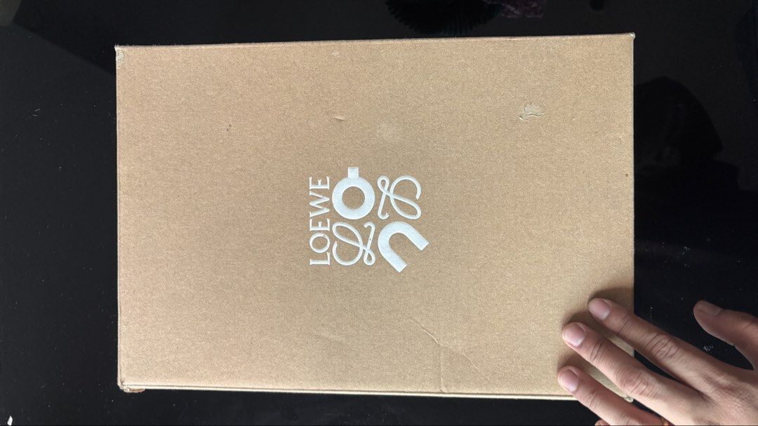 Loewe x On Cloud 2.0 Grey (Category: Sneakers) located in Quezon City. Submitted by clivereyes (Listing ID 1425401529, Image 1). Description: For Sale Loewe x On Cloud 2.0 Grey Size: 9.5 US M SRP is 40k Selling for 25k Negotiable Honest issue Box has water damage.