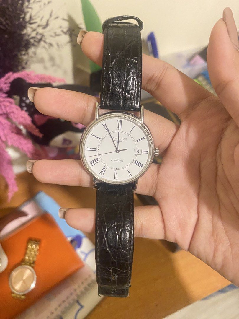 Longines Presence Automatic Watch with original belt (Category: Luxury Watches) located in Manila. Submitted by ajustinet96725 (Listing ID 1425306946, Image 1). Description: Brand: Longines Model: Présence Automatic Reference: L4.821.4.11.2 Movement: Swiss Automatic (self-winding) Case: Stainless steel Dial: Clean white dial with Roman numerals Crystal: Scratch-resistant sapphire Style: Classic dress watch Condition: Good condition (normal light 