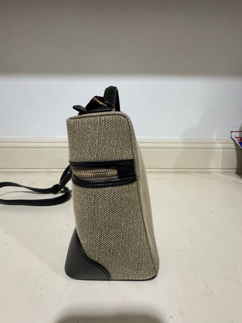 Loro L27 canvas (Category: Cross-body Bags) located in Cebu City. Submitted by refabph (Listing ID 1425285703, Image 2). Description: Loro Piana Canvas L27 • Beige canvas body • Black leather trim & handle • Gold hardware with LP zipper pull • Structured vanity style • Detachable shoulder strap • Japan sourced Condition: Good pre-owned condition with minor flaw ✔ Clean interior ✔ Structure intact ✔ Hardware shiny Note: Small stain at the back (se