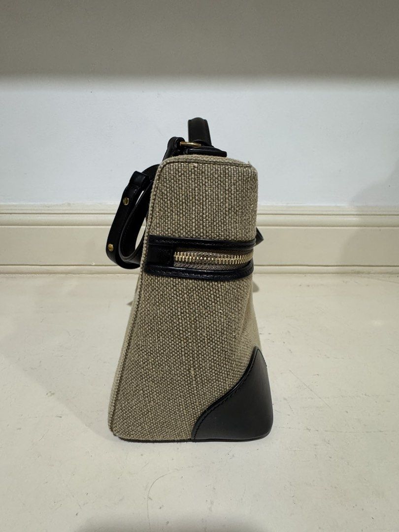 Loro L27 canvas (Category: Cross-body Bags) located in Cebu City. Submitted by refabph (Listing ID 1425285703, Image 3). Description: Loro Piana Canvas L27 • Beige canvas body • Black leather trim & handle • Gold hardware with LP zipper pull • Structured vanity style • Detachable shoulder strap • Japan sourced Condition: Good pre-owned condition with minor flaw ✔ Clean interior ✔ Structure intact ✔ Hardware shiny Note: Small stain at the back (se