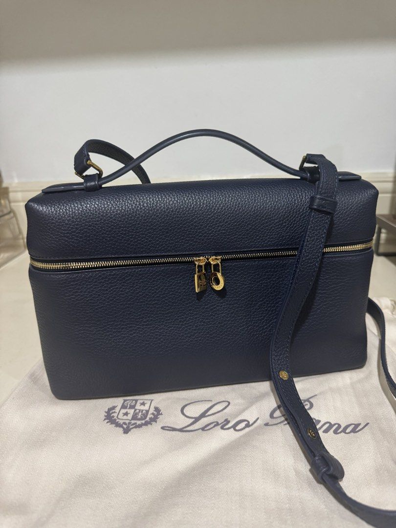 Loro L27 navy (Category: Cross-body Bags) located in Cebu City. Submitted by refabph (Listing ID 1425285704, Image 1). Description: - Loro Piana L27 Navy Cross-body Bag - authentic grained leather • Signature LP zipper pulls • Gold hardware • Top handle carry • Structured vanity silhouette • Includes Loro Piana dust bag - Japan sourced, no personal guarantee Condition: Very good pre-owned condition ✔ Leather well maintained ✔ Clean structure ✔ Ha