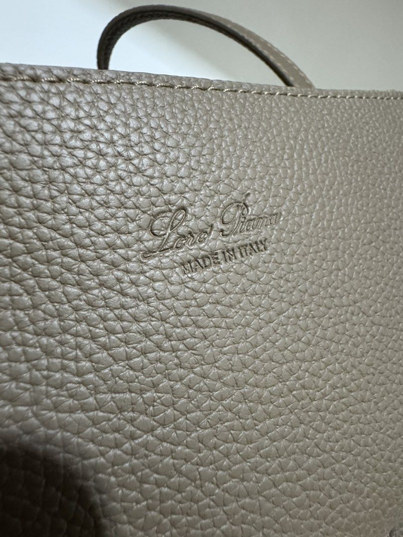 Loro Needle Bowling bag (Category: Shoulder Bags) located in Cebu City. Submitted by refabph (Listing ID 1425285702, Image 3). Description: Loro Piana Leather Needle Bowling bag • Taupe grained leather • Top handle carry • Gold LP lock charm • Structured silhouette • Includes detachable strap • Includes matching pouch Condition: Very good pre-owned condition ✔ Leather in beautiful shape ✔ Clean interior ✔ Minimal signs of use Timeless neutral ton
