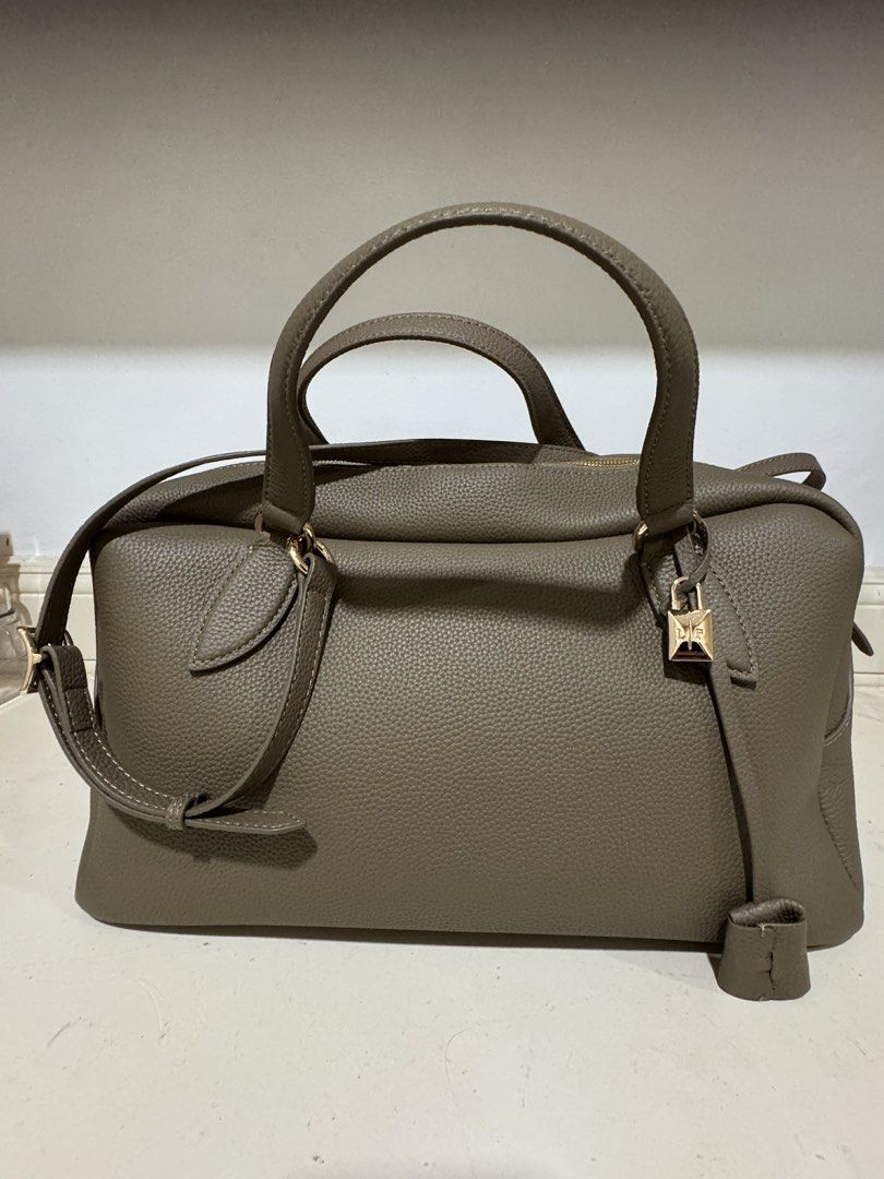Loro Needle Bowling bag (Category: Shoulder Bags) located in Cebu City. Submitted by refabph (Listing ID 1425285702, Image 1). Description: Loro Piana Leather Needle Bowling bag • Taupe grained leather • Top handle carry • Gold LP lock charm • Structured silhouette • Includes detachable strap • Includes matching pouch Condition: Very good pre-owned condition ✔ Leather in beautiful shape ✔ Clean interior ✔ Minimal signs of use Timeless neutral ton