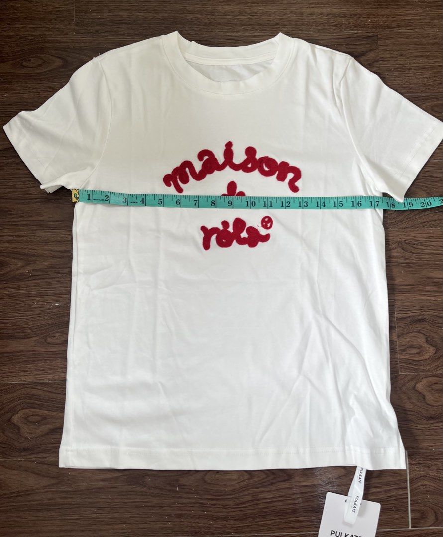 Maison de Rola White T-shirt (Category: Shirts) located in Angeles City. Submitted by emflores (Listing ID 1423810878, Image 3). Description: - White t-shirt - Features a red "maison de Rola" logo - Classic crew neck design - Comfortable short sleeves - Bought in Bangkok.