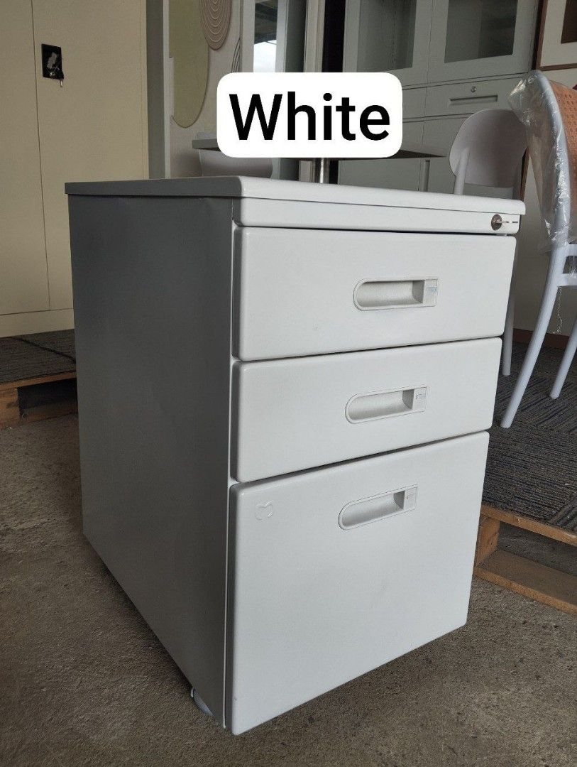 Metal Drawer Cabinet - White and Gray (Category: Shelves, Cabinets & Racks) located in Binan City. Submitted by plesisrhin96177 (Listing ID 1425425488, Image 3). Description: Durable metal drawer cabinets available in white and gray. Each cabinet has three drawers with handles and a lock. The cabinets are stackable and suitable for office or home use. They are ideal for organizing documents, supplies, or personal items. Available in multiple quan