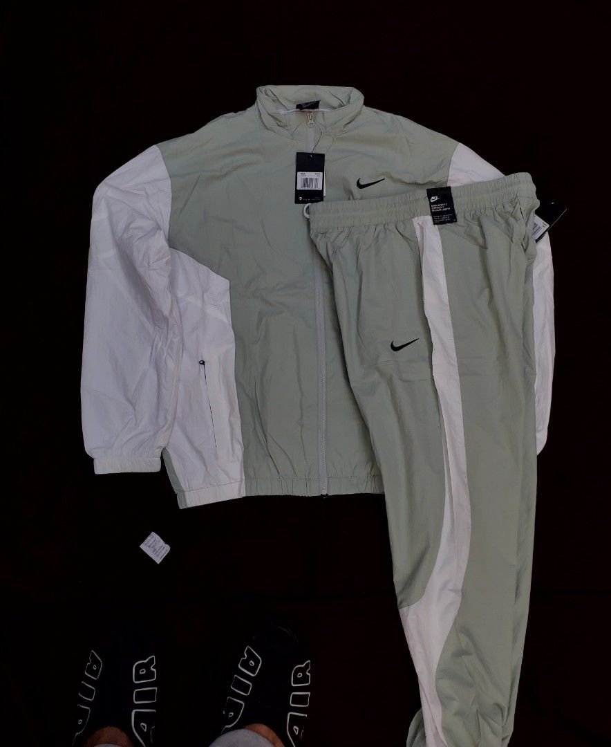 Nike Tracksuit Set (Category: Sets & Coordinates) located in Manila. Submitted by calmstone-29ee (Listing ID 1425272126, Image 1). Description: Nike tracksuit set in a light green and white colorway. Includes a jacket and matching pants. Features the Nike logo on both the jacket and pants..