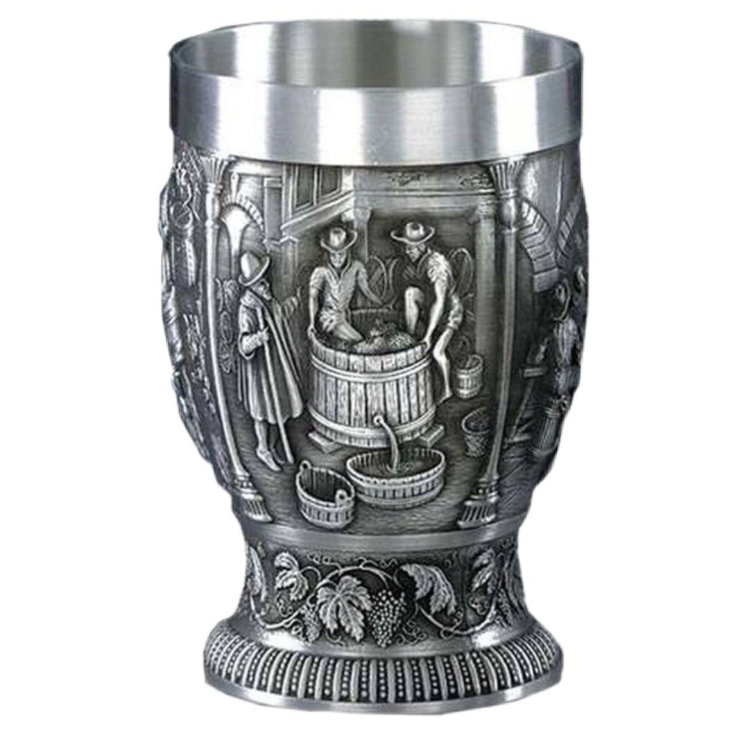 Pewter Vintage Cup Made in Germany (Category: Coffee & Tea Tableware) located in Las Pinas. Submitted by jeidiji (Listing ID 1425385398, Image 1). Description: Vintage pewter mug features a detailed relief scene. The mug has a wide rim and a decorative base with grape vine detailing. The body of the mug showcases a scene with figures, barrels, and other elements..