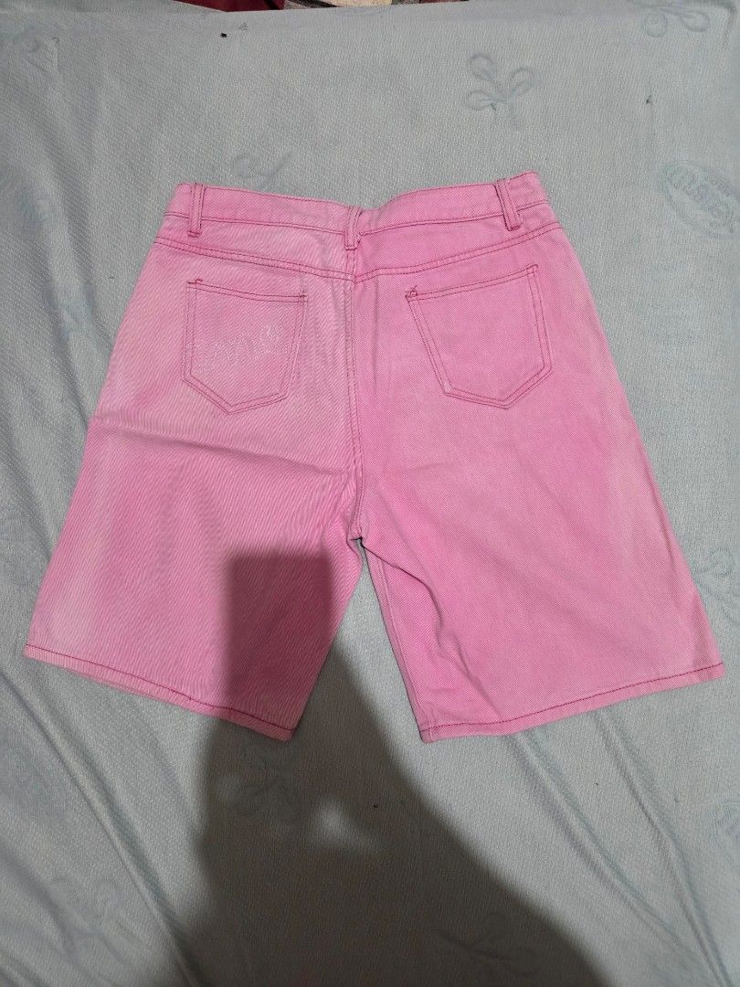 Pink Denim Shorts (Category: Shorts) located in Manila. Submitted by declutterwtly (Listing ID 1425386993, Image 2). Description: Send me your offers, TYSM! ♡ -Pink denim jorts feature a classic five-pocket design. -They have a button and zipper closure. -The shorts appear to be a standard fit, suitable for casual wear. -The shorts have a faded look..