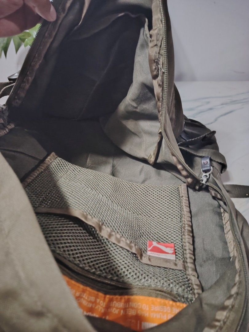 Puma Backpack (Category: Backpacks) located in Manila. Submitted by drxx.drip_19 (Listing ID 1425276003, Image 2). Description: Puma backpack features multiple compartments, including a mesh pocket and a main compartment with a zipper closure. It has adjustable straps and a top handle for carrying. The backpack is made in China and has the Puma logo on the front and straps. The dimensions are approximately 43cm in height and 30cm in width..
