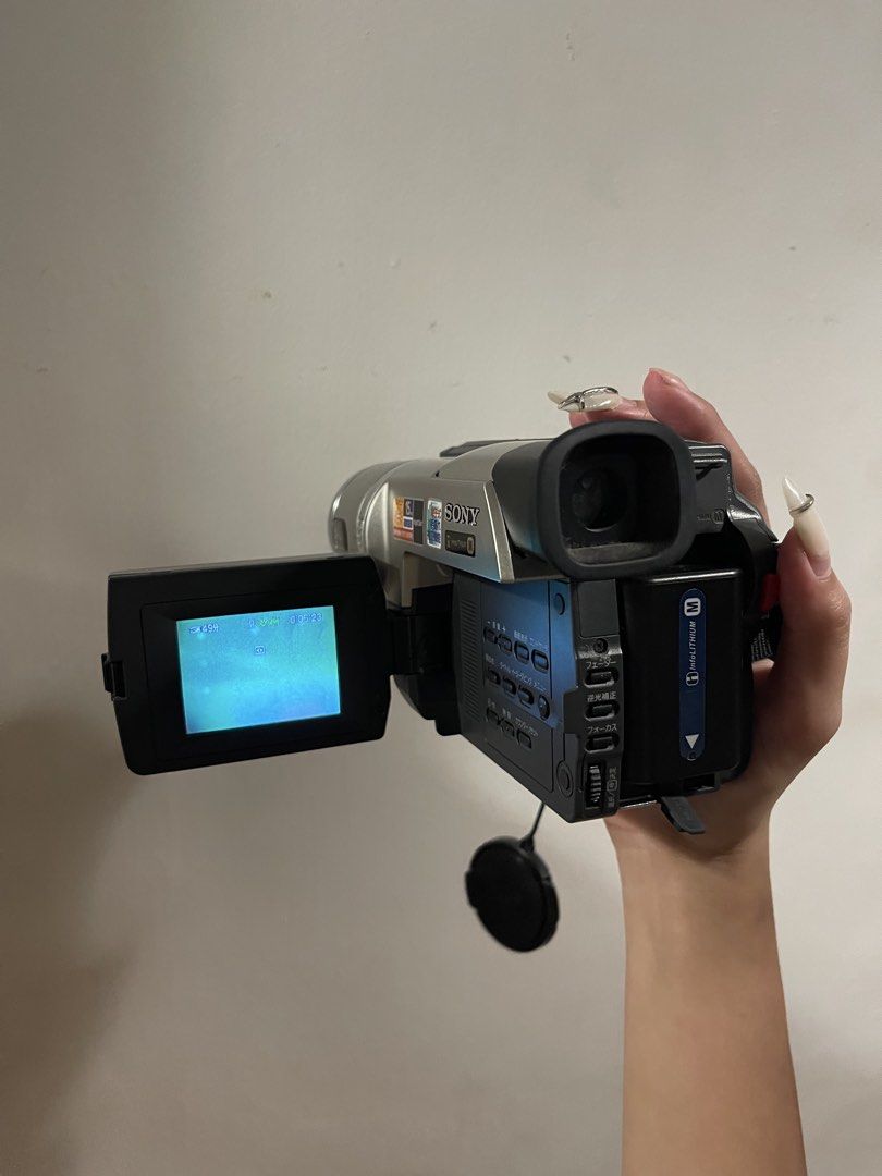 Sony Handycam VHS Hi8 Camcorder (Category: Video Cameras) located in Pasay City. Submitted by synag (Listing ID 1425433993, Image 2). Description: SONY CCD-TRV96 NTSC Condition: 8/10 (Cosmetics) Japanese Language but easy to use • Night Vision working • All buttons working • Tape eject working • Light working • Viewfinder doesn’t work anymore • LCD is working but has a minor burn (common for VHS camcorders) Includes: • Bag • Charger Note: Battery