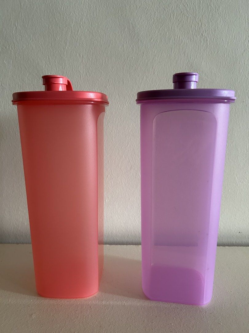Tupperware Modular Mates Rectangular Containers (Category: Food Organisation & Storage) located in Singapore. Submitted by yipfh (Listing ID 1425290327, Image 1). Description: Tupperware fridge water bottles rectangular containers. 2L each. One in pink and one in purple. Lids are included. $15 each, 2 for $28.