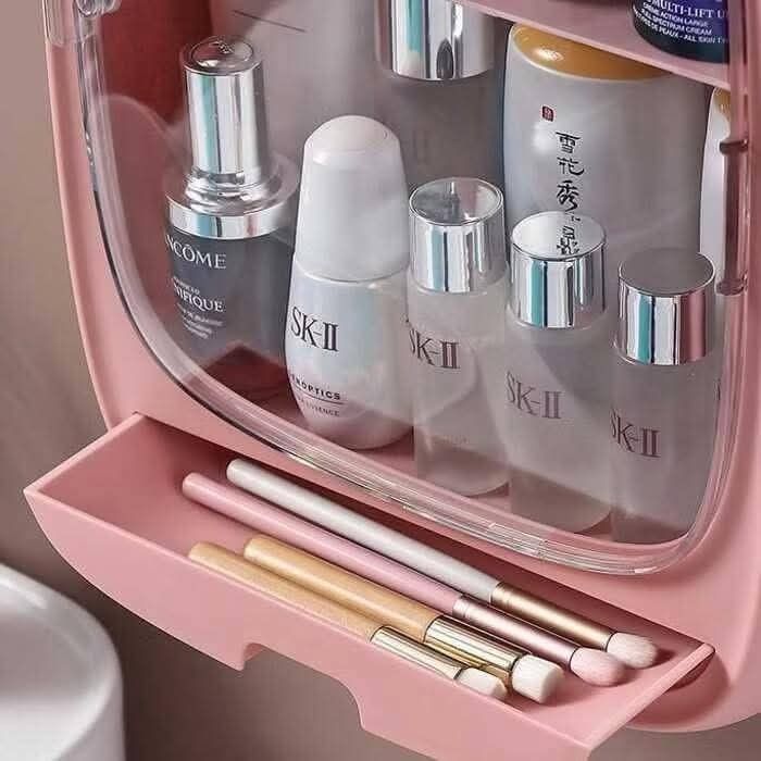 Wall-Mounted Cosmetic Organizer (Category: Makeup) located in Manila. Submitted by yzlshop (Listing ID 1425272948, Image 3). Description: Wall-mounted cosmetic organizer is perfect for storing your skincare and makeup essentials. It features multiple compartments and a small drawer for brushes or smaller items. Available in pink and blue. Dimensions are approximately 20cm height, 15.5cm width, and 11cm depth. The door is transparent, allowing you