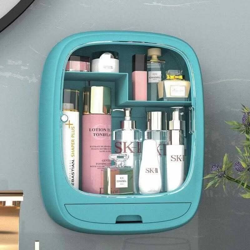 Wall-Mounted Cosmetic Organizer (Category: Makeup) located in Manila. Submitted by yzlshop (Listing ID 1425272948, Image 2). Description: Wall-mounted cosmetic organizer is perfect for storing your skincare and makeup essentials. It features multiple compartments and a small drawer for brushes or smaller items. Available in pink and blue. Dimensions are approximately 20cm height, 15.5cm width, and 11cm depth. The door is transparent, allowing you