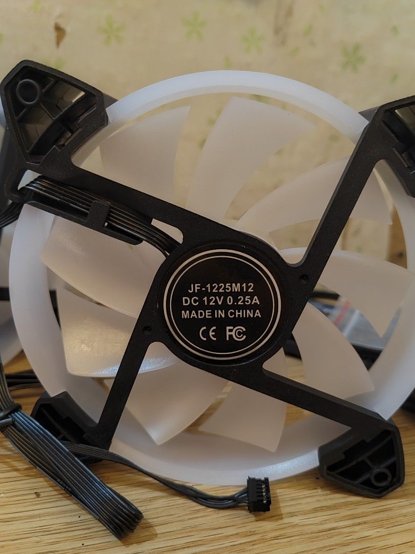 12cm RGB Cooling Fans Quiet Computer Case Chassis Fan Computer PC Cooler for PC Computer CPU 5pcs (Category: Computer Parts) located in Makati City. Submitted by jdcgarcia003381 (Listing ID 1425540671, Image 3). Description: Set of PC cooling fans with an included controller and remote. The fans are JF-1225M12 model, DC 12V 0.25A. Includes a controller with multiple fan ports and LED strip ports. The remote allows for color and mode control. Incl