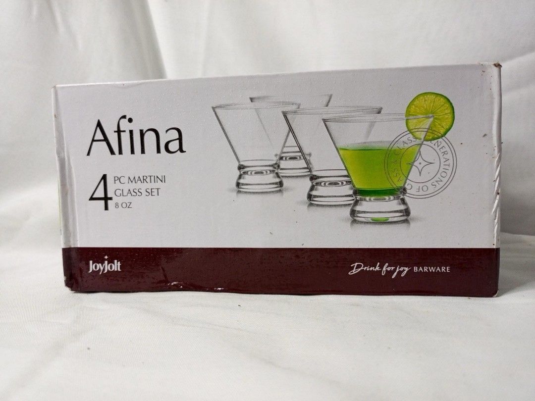 Afina Martini Glass Set - 4 Pieces (Category: Other Kitchenware & Tableware) located in Marikina City. Submitted by caiteeekat (Listing ID 1425550940, Image 1). Description: Set of four Afina martini glasses. Each glass is 6 oz. Perfect for serving cocktails at home or for entertaining guests. The glasses are designed with a classic martini shape. The box indicates it is from Joyjolt Barware..