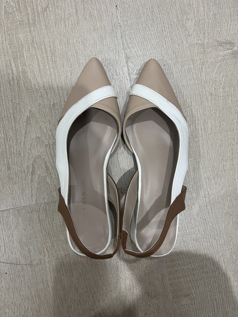 Astrid Slingback Pointed-Toe Sandals (Category: Flats & Sandals) located in Cebu City. Submitted by elle.db (Listing ID 1425603574, Image 1). Description: Stylish slingback sandals featuring a pointed toe design. The sandals have a color-block design with beige, white, and brown accents. They have a low block heel and a strap around the ankle for a secure fit. Perfect for adding a touch of elegance to any outfit. NEVER USED RFS: Not really into t
