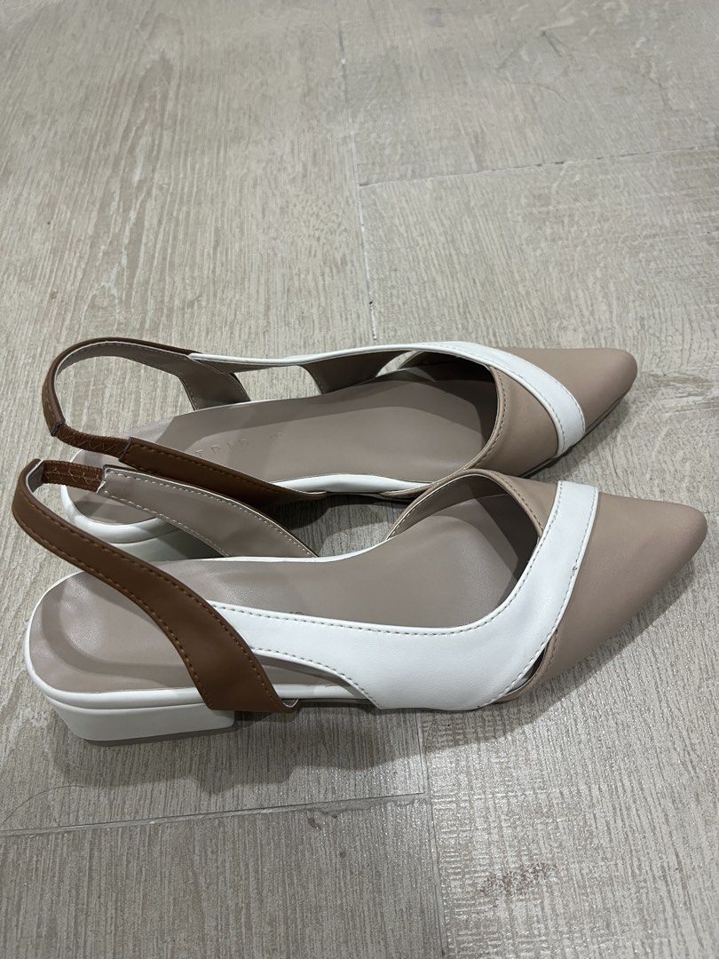 Astrid Slingback Pointed-Toe Sandals (Category: Flats & Sandals) located in Cebu City. Submitted by elle.db (Listing ID 1425603574, Image 2). Description: Stylish slingback sandals featuring a pointed toe design. The sandals have a color-block design with beige, white, and brown accents. They have a low block heel and a strap around the ankle for a secure fit. Perfect for adding a touch of elegance to any outfit. NEVER USED RFS: Not really into t