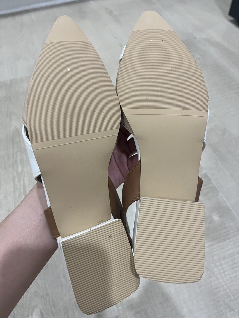 Astrid Slingback Pointed-Toe Sandals (Category: Flats & Sandals) located in Cebu City. Submitted by elle.db (Listing ID 1425603574, Image 3). Description: Stylish slingback sandals featuring a pointed toe design. The sandals have a color-block design with beige, white, and brown accents. They have a low block heel and a strap around the ankle for a secure fit. Perfect for adding a touch of elegance to any outfit. NEVER USED RFS: Not really into t