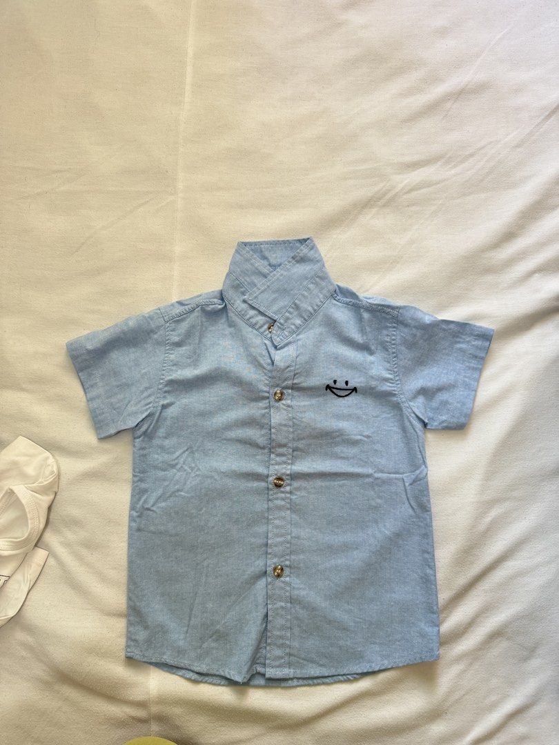 Blue Short Sleeve Shirt with Smiley (Category: Babies & Kids Fashion) located in Lucena. Submitted by jaejae___ (Listing ID 1425628671, Image 1). Description: .