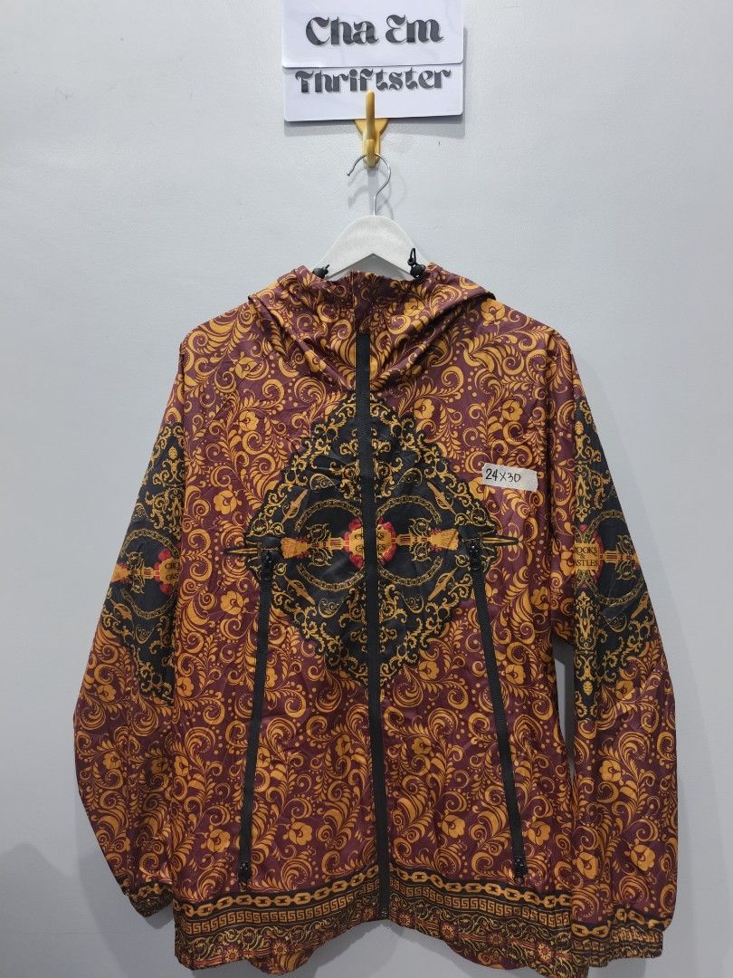 Crooks & Castles Floral Print Jacket (Category: Coats, Jackets and Outerwear) located in Leyte. Submitted by chaem89 (Listing ID 1425583330, Image 1). Description: Jacket features a vibrant floral print with a unique design. It has a full zipper closure and a hood. The jacket is a size L/G and is made of 100% polyester. The jacket has a distinctive pattern on the front and back. It is a stylish piece for everyday wear. -Excellent Cond -sz L on ta