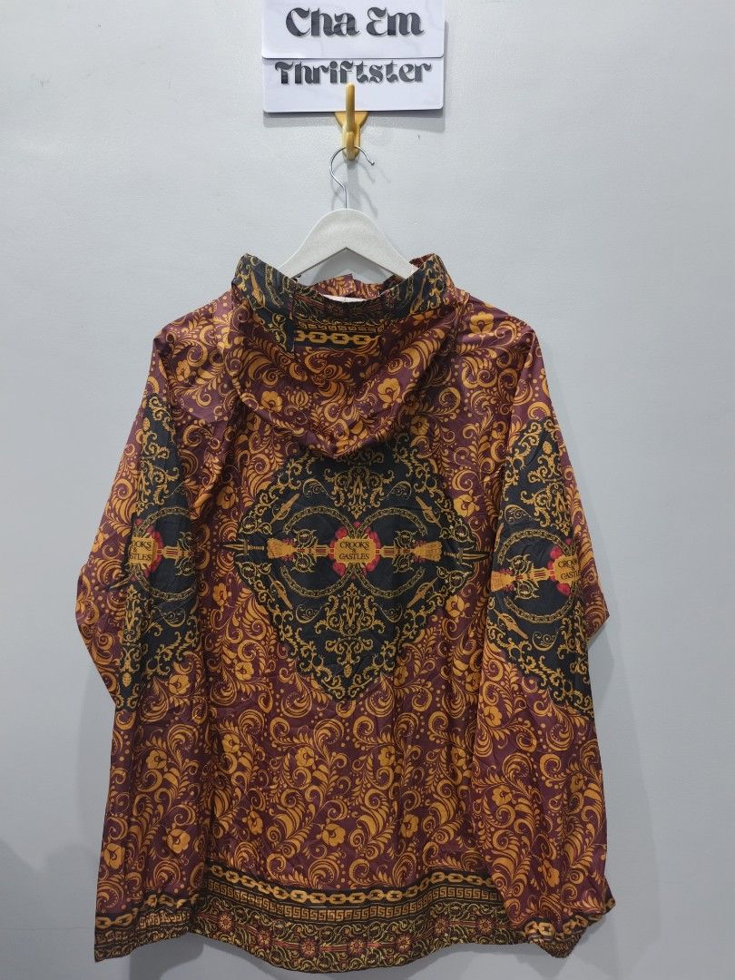 Crooks & Castles Floral Print Jacket (Category: Coats, Jackets and Outerwear) located in Leyte. Submitted by chaem89 (Listing ID 1425583330, Image 2). Description: Jacket features a vibrant floral print with a unique design. It has a full zipper closure and a hood. The jacket is a size L/G and is made of 100% polyester. The jacket has a distinctive pattern on the front and back. It is a stylish piece for everyday wear. -Excellent Cond -sz L on ta