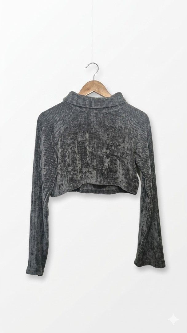 Cropped Turtleneck Top (Category: Longsleeves) located in Manila. Submitted by declutter_s (Listing ID 1425581323, Image 1). Description: Cropped top features a turtleneck design and long sleeves. It has a textured, knitted velvet-like fabric. The top is a dark grey color. It is a stylish piece that can be paired with high-waisted bottoms for a chic look..