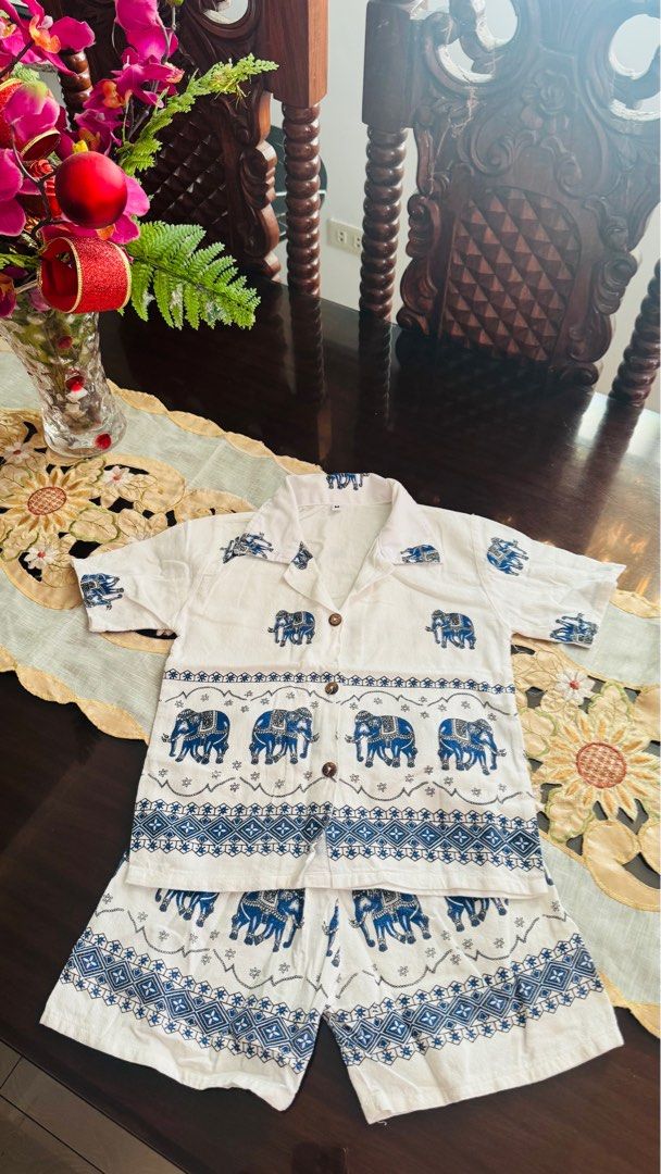 Elephant Print Shorts Set from Thailand (Category: Babies & Kids Fashion) located in Lumban. Submitted by miloveditems (Listing ID 1425631024, Image 1). Description: - Elephant Print Shorts Set from Thailand - Features a charming elephant design in blue on white - Includes a shirt and shorts - Perfect for kids.