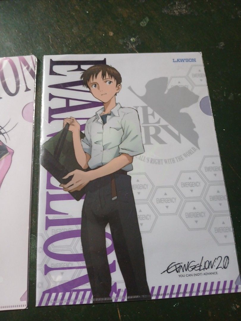 Evangelion Clear File Set (Category: Stationery & School Supplies) located in Manila. Submitted by diczenestr94951 (Listing ID 1425467234, Image 2). Description: Listing is for a set of Evangelion clear files. The set includes both the purple and pink designs. Each clear file is sealed in its original packaging. The clear files feature various Evangelion designs and Japanese text. Perfect for any Evangelion fan or collector..