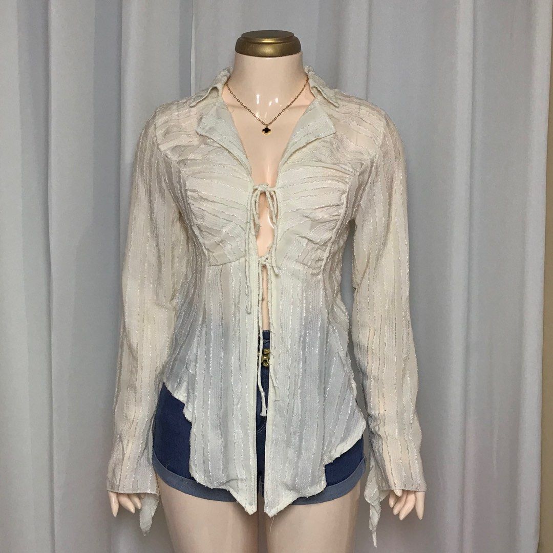 Fairy core Lace up Tie-Front Blouse (Category: Blouses) located in Pagadian. Submitted by picknpack (Listing ID 1425486611, Image 1). Description: •freeszie (self tie) •semi mesh, no issue •magandaaa sa personall🥹💯 •color: cream white.