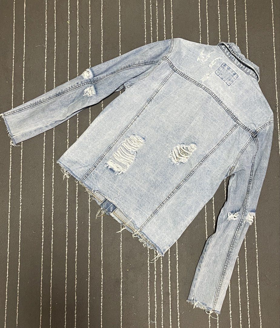 Forever 21 Distressed Denim Jacket - XS (Category: Coats, Jackets and Outerwear) located in Manila. Submitted by mrbrightside06 (Listing ID 1425585817, Image 2). Description: Selling my preloved distressed F21 denim jacket. Worn once/twice only. Needs washing as it was kept in the cabinet for a while. Bought for 2,499. RFS: not my size anymore Can do shipping at buyer’s expense..