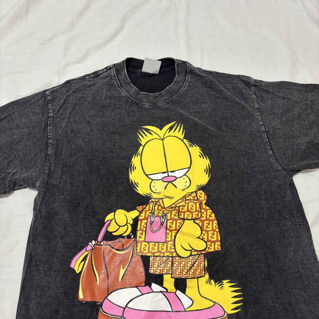 Garfield Graphic Tee (Category: Tshirts & Polo Shirts ) located in Cabuyao City. Submitted by nesse21 (Listing ID 1425549569, Image 1). Description: BKK Oversized Garfield Shirt Condition: New Size: Can fit Large to XL.