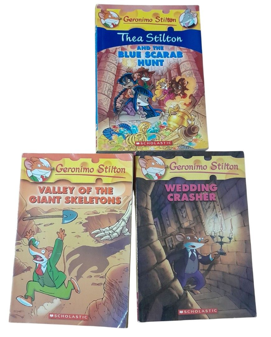 Geronimo Stilton Books - Set of 3 (Category: Children's Books) located in Mandaluyong City. Submitted by twixie94147 (Listing ID 1425555260, Image 1). Description: Set of three Geronimo Stilton books. Titles include "Thea Stilton and the Blue Scarab Hunt", "Valley of the Giant Skeletons", and "Wedding Crasher". These books are from the Scholastic series. Perfect for young readers who enjoy adventure and mystery stories. Each book features colorfu