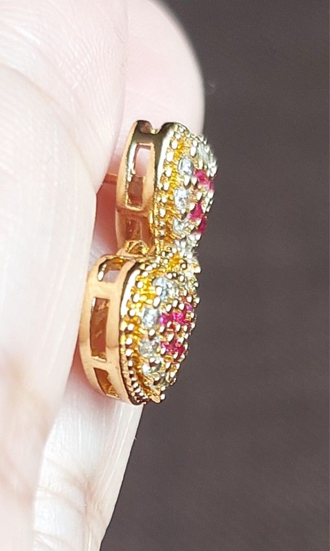 Gold Stud Earrings Set (Category: Earrings) located in Gapan. Submitted by purseofjune (Listing ID 1425482600, Image 3). Description: heart stud ruby and white stone P400 flower stud yellow stone P300 flower stud ruby P400 set for P800 in gold plated copper, ruby stone is uv reactive hypo allergenic long lasting plating with proper care.