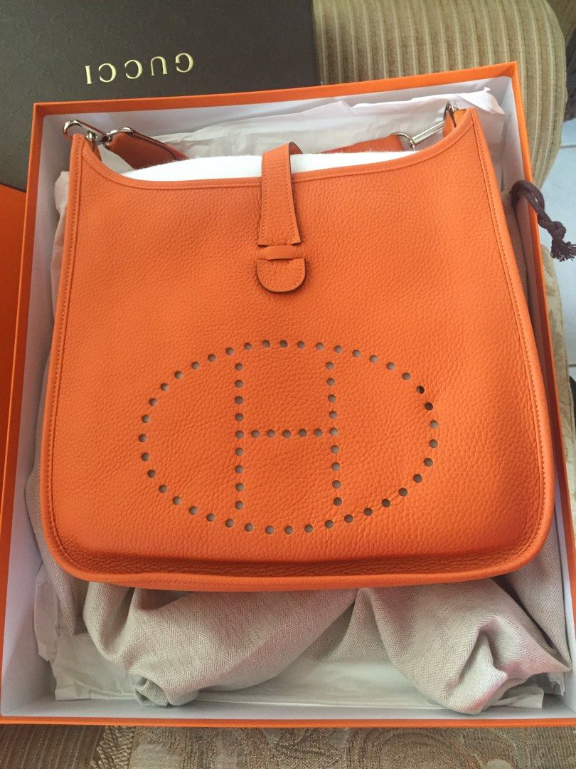 Hermes Evelyne III Orange Handbag (Category: Luxury Bags & Wallets) located in Makati City. Submitted by iamstorm77 (Listing ID 1425491038, Image 1). Description: Used once! Complete with dust bag, stuffings, box. In super excellent condition— like new! Additional photos upon request. Serious buyers only, no low-balling please. .