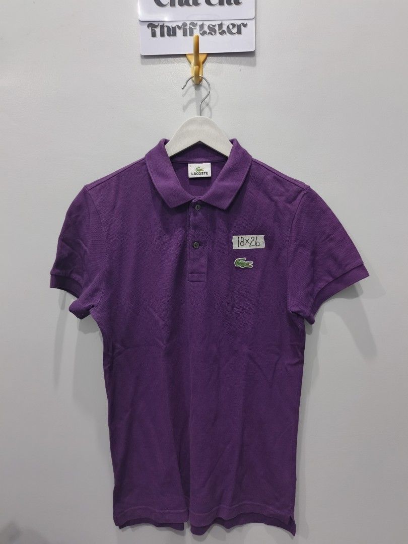 Lacoste Purple Polo Shirt (Category: Tshirts & Polo Shirts ) located in Leyte. Submitted by chaem89 (Listing ID 1425590457, Image 1). Description: Authentic Lacoste polo shirt in a vibrant purple color. Features the iconic Lacoste logo on the chest. The shirt has a classic polo collar and short sleeves. Size 4. Made from 100% cotton. Perfect for casual wear. -Very Good Cond - Issue: slight fade neck fold (refer to last photo) -sz 4 on tag 18x26.