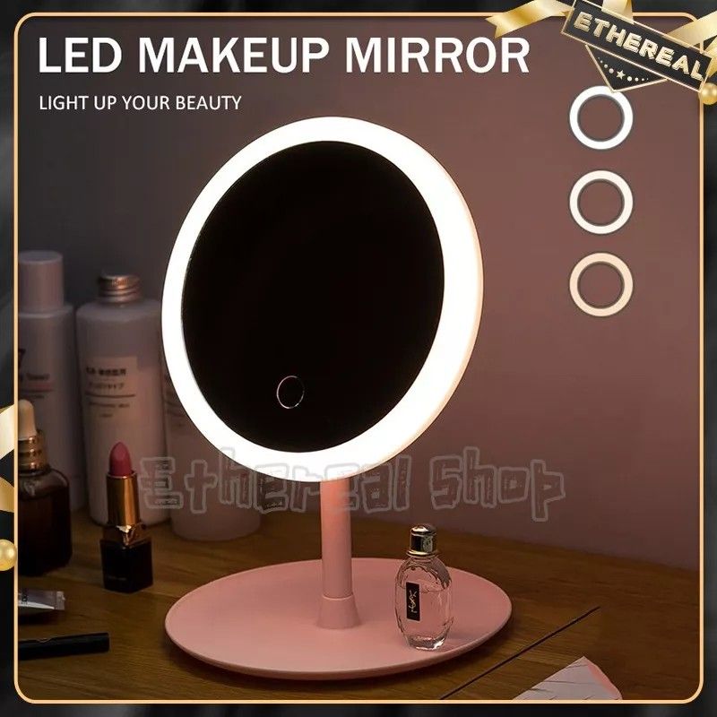 LED Makeup Mirror with Adjustable Brightness (Category: Makeup) located in Cebu City. Submitted by gracemarvin06 (Listing ID 1425542651, Image 2). Description: LED makeup mirror features a touch-sensitive switch to change the light and a long press function to adjust the brightness. It has a circular design with a built-in LED light for optimal illumination. The mirror is pink and has a stable base. Perfect for applying makeup or skincare routine