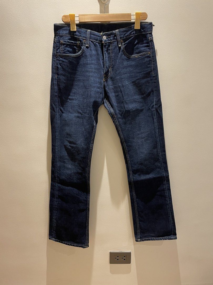 Levi's 527 Jeans - W31 L32 (Category: Jeans) located in Makati City. Submitted by LunaMari (Listing ID 1425519234, Image 3). Description: Levi's 527 jeans in a dark wash. Features a classic five-pocket design with a button closure and a zip fly. The back pocket hhas the signature Levi's stitching. The jeans have a W31 L32 size. The care label indicates washing instructions. Dimensions: Waist 34 inches Length 40.5 inches Inseam 31.5 inches.