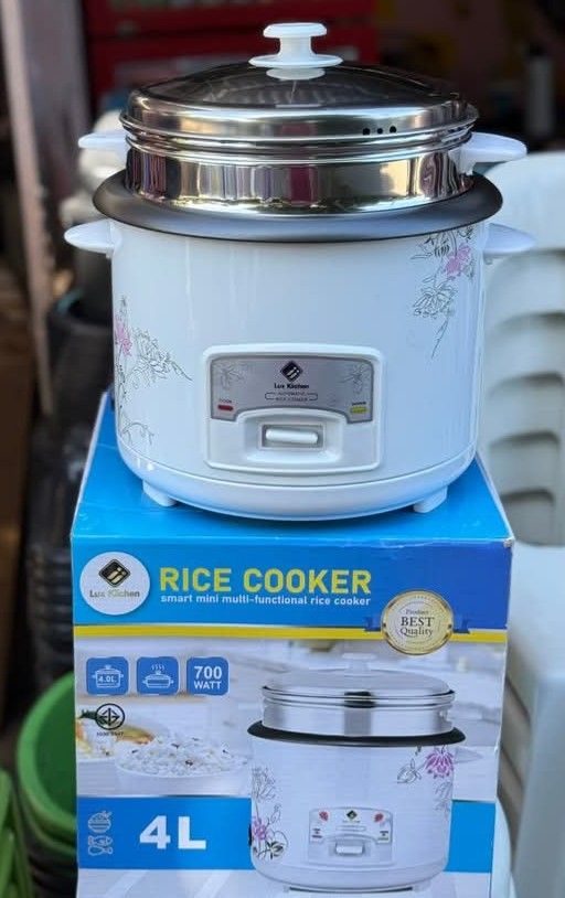 Lux Kitchen 4L Rice Cooker (Category: Cookers) located in Cebu City. Submitted by gracemarvin06 (Listing ID 1425489905, Image 1). Description: Lux Kitchen rice cooker is a smart mini multi-functional appliance. It has a 4L capacity and operates at 700 watts. The set includes a steamer and comes with a rice paddle and measuring cup. The cooker features a floral design and has indicator lights for easy operation..
