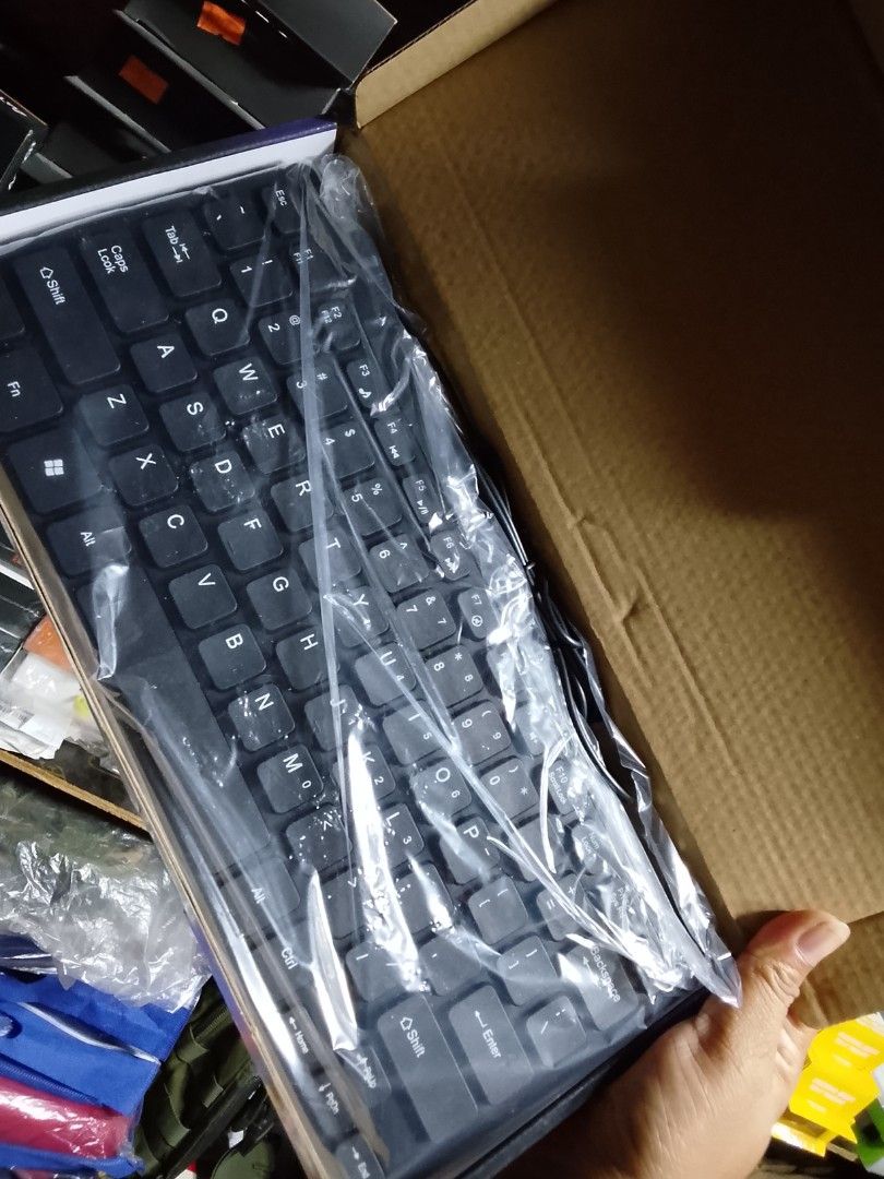 Mini Keyboard K1060 (Category: Computer Keyboard) located in Cebu City. Submitted by gracemarvin06 (Listing ID 1425541155, Image 2). Description: Mini keyboard, model K1060. It is black and comes in its original packaging. The keyboard is wired. It is designed for MAC and PC. The box shows the keyboard's design. The keyboard is still in its original plastic wrapping..