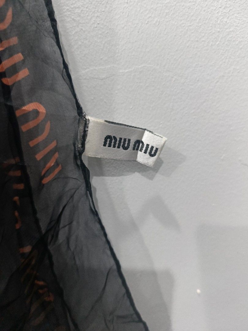 Miu Miu Harlequin Silk Scarf (Category: Luxury Accessories) located in Leyte. Submitted by chaem89 (Listing ID 1425599222, Image 3). Description: Limited Edition Miu Miu Harlequin silk scarf. Features a colorful geometric and artistic design. The scarf is made in Italy and is 100% silk. The scarf has the Miu Miu logo printed on it. The dimensions are approximately 68x28 inches. .
