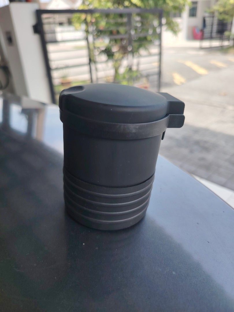 Multipurpose Container (Category: Others) located in Kuala Lumpur. Submitted by syahniz.store (Listing ID 1425580893, Image 1). Description: Multipurpose container. It is designed to hold small items like coins and candies. The container has a lid that opens and closes. It is black in color..
