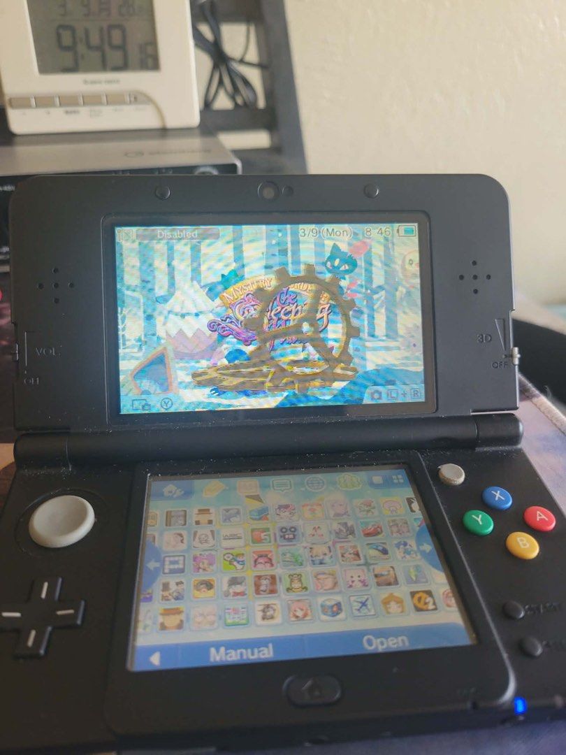 New Nintendo 3DS (Category: Nintendo) located in Manila. Submitted by maeelizabe63182 (Listing ID 1425448932, Image 3). Description: - 128 gb cfw already -Audio interface working New Black Nintendo 3DS console. The console is in working condition and shows the home screen with several game icons. The top screen displays a game. The console has the volume slider, 3D slider, and other buttons. The back of the console has the game card slot and head