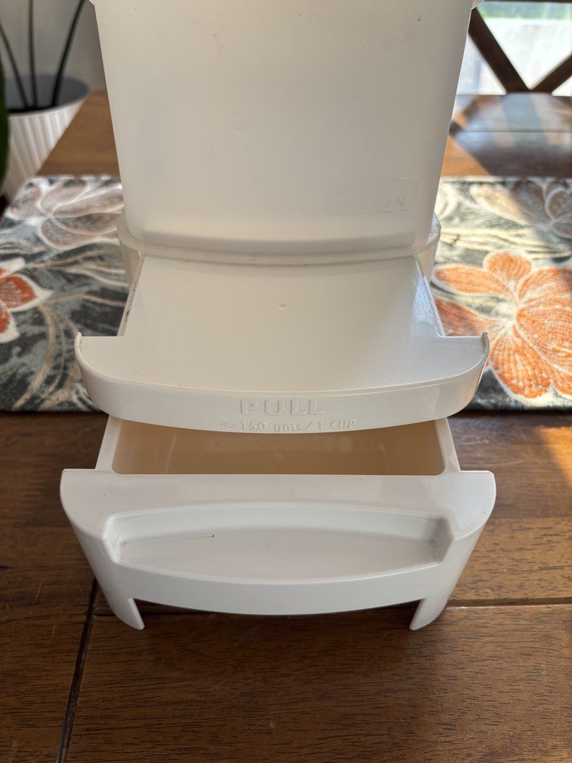 Orocan Ricegard Rice Dispenser (Category: Food Organization & Storage) located in Tagaytay City. Submitted by kite_estrella (Listing ID 1425526854, Image 3). Description: Orocan Ricegard rice dispenser. It has a pull-out drawer that dispenses approximately 150 gms / 1 cup of rice. The dispenser has a capacity of 10 kg. It has a clear body with measurement indicators. The dispenser is white and has a lid..