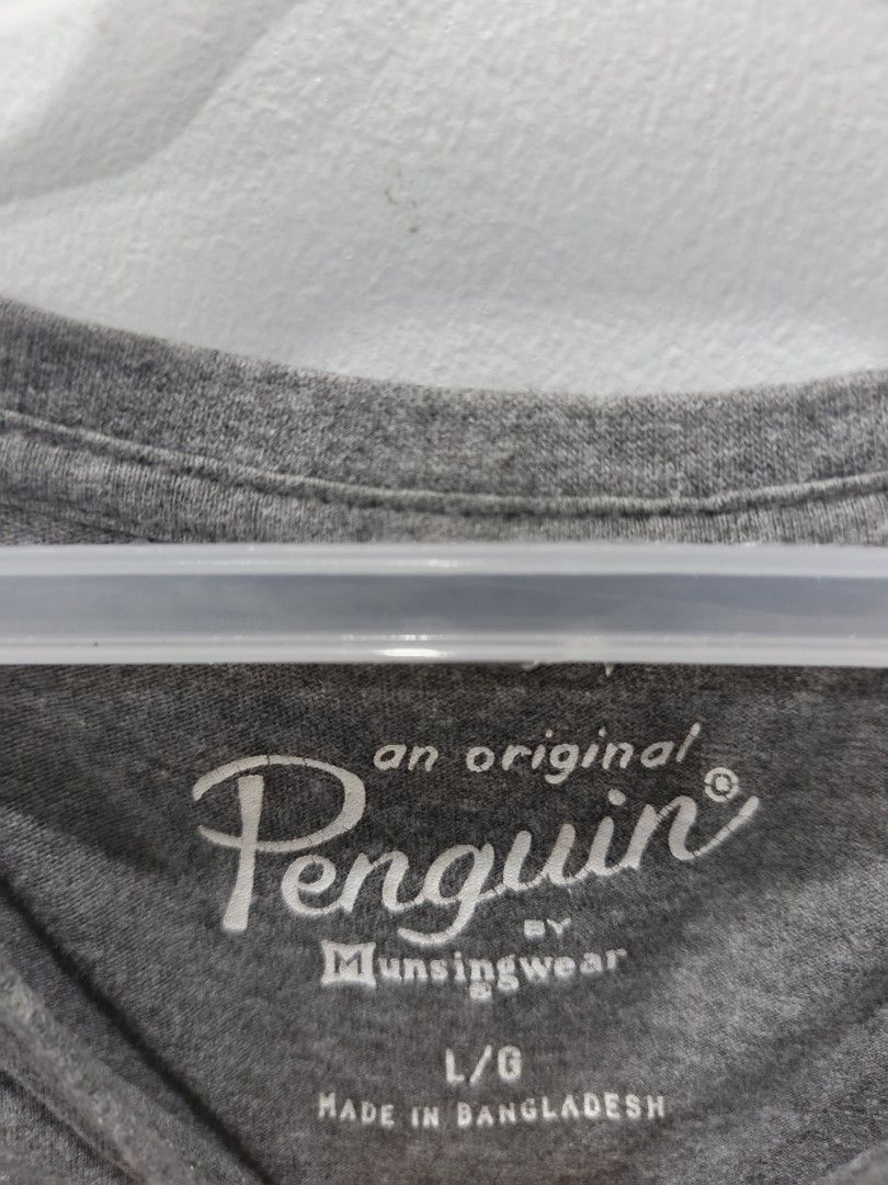 Penguin Gray T-shirt (Category: Tshirts & Polo Shirts ) located in Leyte. Submitted by chaem89 (Listing ID 1425581682, Image 3). Description: Original Penguin gray t-shirt. Features the brand's logo on the front. Made of 70% cotton and 30% viscose. Made in Bangladesh. The shirt has a crew neck and short sleeves. The shirt has a refined athletic wear design. -Excellent Condition -sz M on tag 22x26.